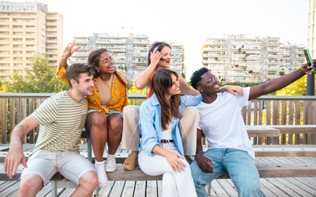 Multiracial group of friends making a selfie with phone in the city- friendship, happiness and joyful conceptの写真素材