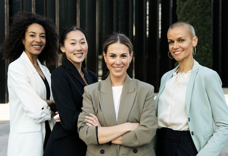 Multiracial group of successful confident women office corporate professional experts. Female team smiling looking at camera. Business conceptの写真素材