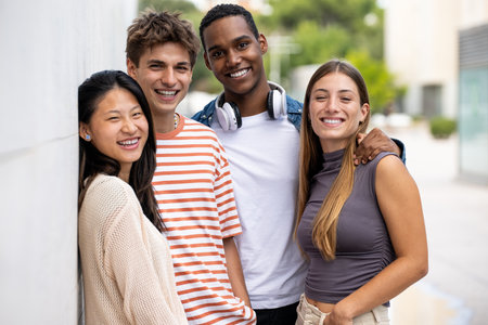 Beautiful young men and women smiling and looking at camera.Diverse group of joyful millennial...