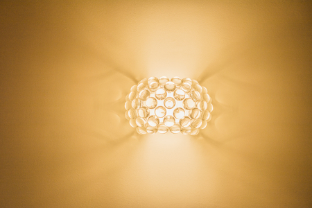 wall lamp on an orange backgroundの写真素材