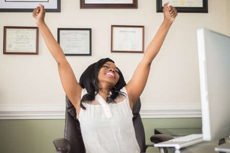 Successful Business Woman Celebratingの写真素材