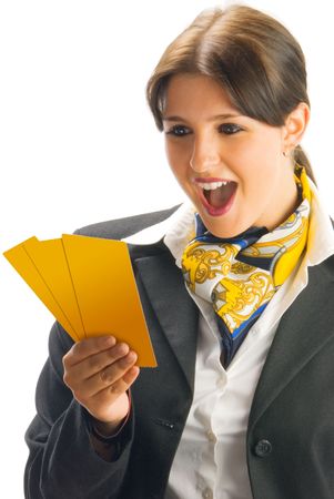 cute and young woman in black suit checking some tickets and making a winner expressionの写真素材