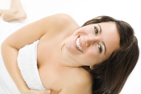 portrait of a beautiful brunette smiling and looking in cameraの写真素材