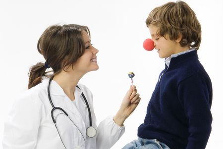 young female doctor having a sweet approach with a little boyの写真素材