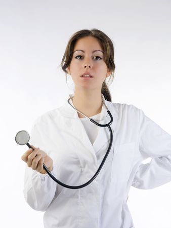 cute brunette in white medical gown   and a stethoscopeの写真素材