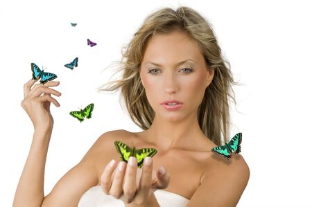 cute and sensual blond girl with flying fruit all around herの写真素材