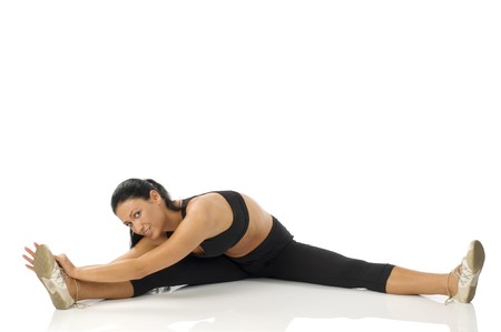 pretty girl strecthing her body making gymの写真素材
