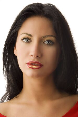 attractive young woman with dark hair and a red and golden creative make upの写真素材