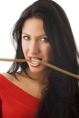 beautiful brunette in red top biting a golden collarの写真素材