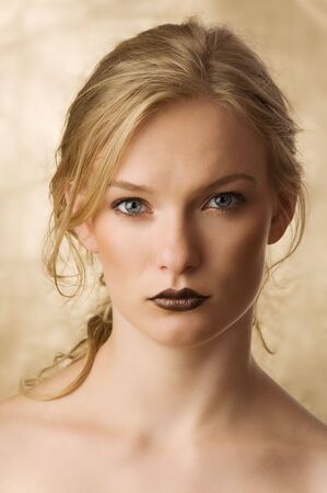 beauty portrait of a cute blond girl with long hair and skin like a dollyの写真素材