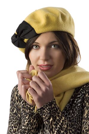 close up portrait of cute girl in winter spotted dress with a nice yellow and black capの写真素材