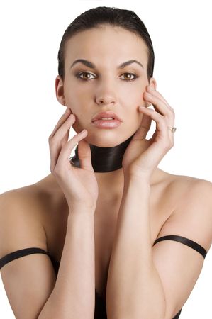 portrait of a young model brunette taking pose with her long black hair around her neck の写真素材