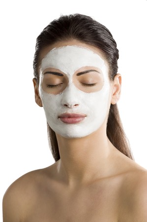 portrait of young woman with beauty mask on her face with closed eyesの写真素材