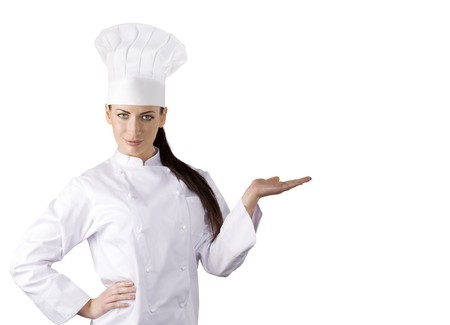 young graceful woman dressed as a cook with cap over white backgoundの写真素材