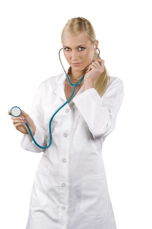 smiling medical doctor woman in act to use the stethoscope Isolated over white background の写真素材