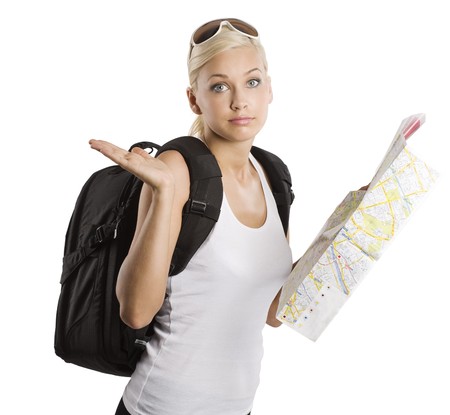 young pretty girl in vacation with map and rucksack looking in camera with funny expressionの写真素材