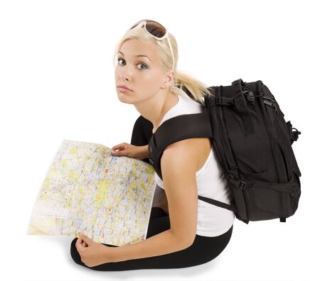 young pretty student girl in vacation with rucksack sitting and looking in cameraの写真素材