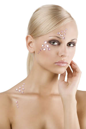 beauty fashion portrait of cute blond girl with creative make up with crystal stoneの写真素材