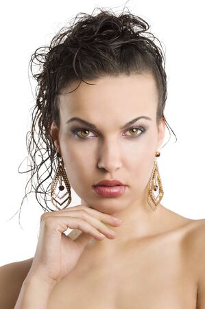 young beautiful brunette woman with hair style and nice jewellery looking in camera
の写真素材