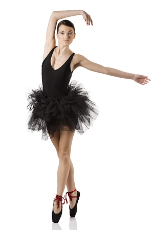 classic dancer with black dress and shoes on white background dancing on pointeの写真素材