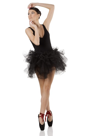 pretty girl classic dancer with black dress and shoes dancing on pointe の写真素材