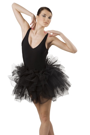 classic dancer with black dress and shoes on white background taking ballet poseの写真素材