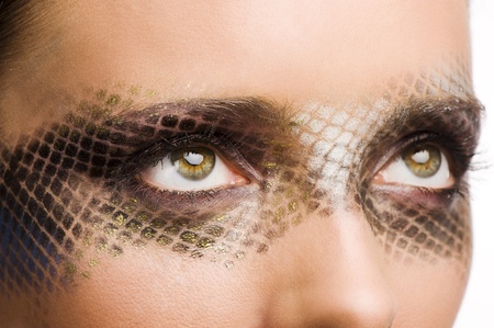 close up beauty portrait of beautiful brunette girl with net faceart over whiteの写真素材