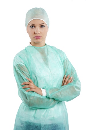 pretty young woman in green surgery dress looking in cameraの写真素材