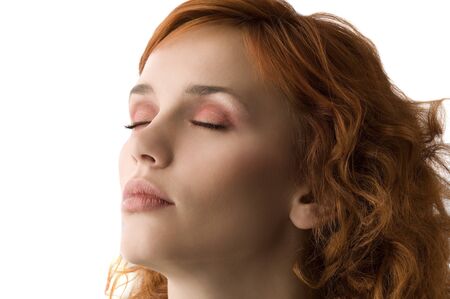 sweet portrait of cute red haired young woman with great makeupの写真素材