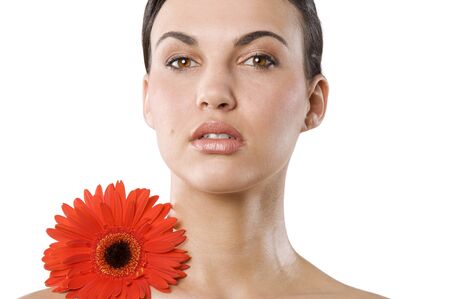 fresh portrait of a young brunette woman wiith color flower no retouch . natural skin
の写真素材