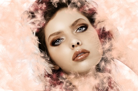 fashion close up of a beautiful girl with soft pink feathers in her hairの写真素材
