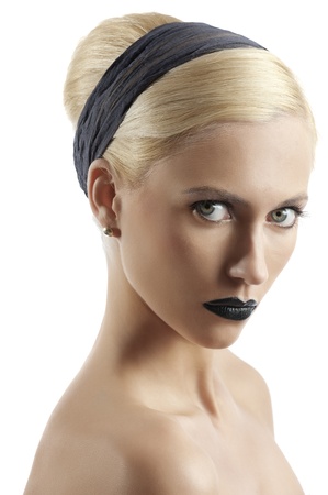 fashion portrait of young blond woman with hair style black lips looking at the camera against white backgroundの写真素材