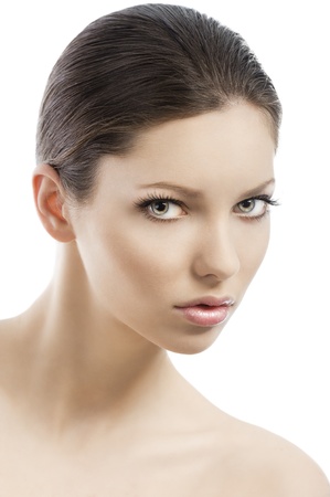 Beauty style portrait of young woman with healthy skin and wet hair . close up on face, she looks in to the lens and she is turned of three-quartersの写真素材