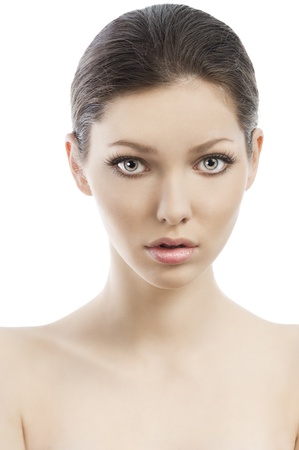 Beauty style portrait of young woman with healthy skin and wet hair . close up on face, she is in front of the camera and looks in to the lensの写真素材