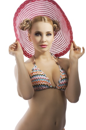 fashion shot of blond sensual lady in bikini taking pose with hat and hair style
の写真素材