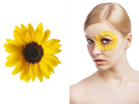 beauty young girl with a floral makeup. She is turned of three quarters and looks in to the lens with attractive expressionの写真素材