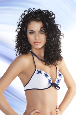 very pretty young woman in blue and white swimsuitの写真素材