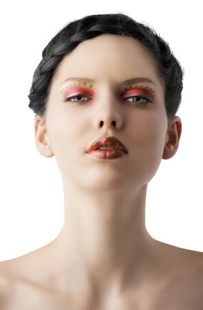 beauty young girl with a floral makeup. She is turned of three quarters and looks in to the lens with attractive expressionの写真素材