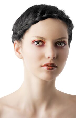 beauty young girl with a floral makeup. She is turned of three quarters and looks in to the lens with attractive expressionの写真素材