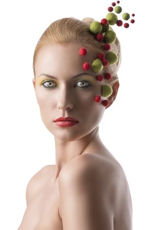 beauty portrait of woman with colored little balls on the faceの写真素材