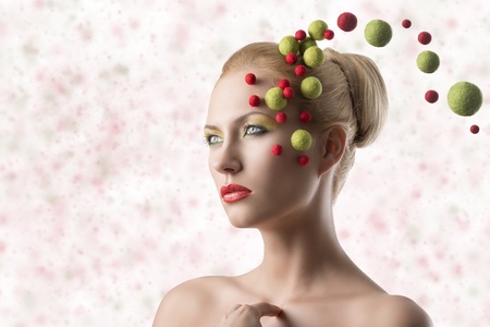close-up portrait of blonde girl with some little spheres on the faceの写真素材