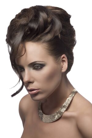 cute brown woman with elegant curly hair-style, pretty make-up, bright necklace and one ringlet on the faceの写真素材