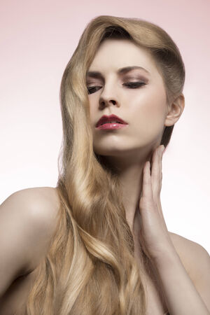 cute close-up fashion portrait of sexy blonde girl with long elegant hair-style, perfect shiny hair の写真素材