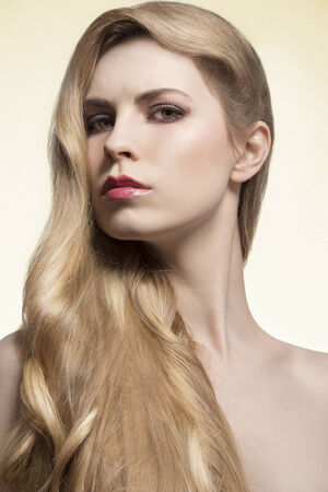 beauty close-up portrait of pretty girl with cute long blonde hair, perfect skin and naked shoulders の写真素材