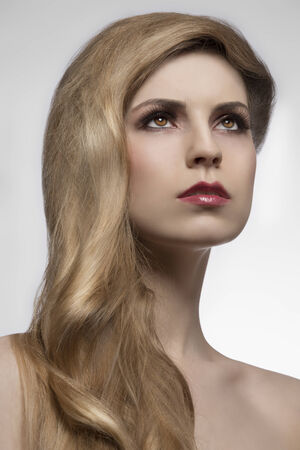 close-up portrait of beauty girl with cute long elegant hair-style, perfect shiny blonde hair. Hair-care concept. Extension の写真素材