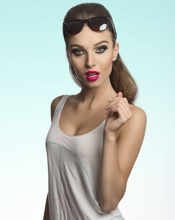 beautiful woman posing in fashion shoot with casual style, cool sunglasses and charming make-up の写真素材