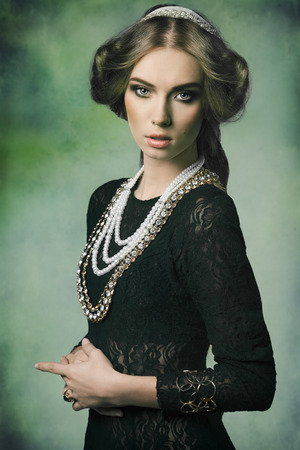 beautiful woman in fantasy portrait with antique princess style, retro hair-style and some brilliant jewellery の写真素材
