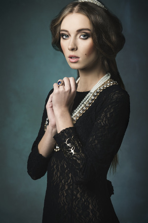 splendid woman with antique aristocratic style posing with retro hair-style, precious crown and jewellery. Retro fashion portrait の写真素材