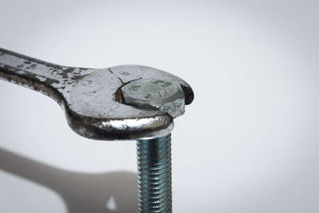 Key and pin photographed in the foreground on a neutral backgroundの写真素材