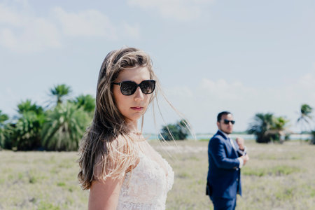 bride and groom in the middle of an islandの写真素材